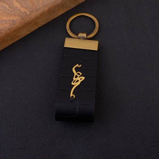 جاکلیدی طلا چرم با پلاک اسم رضا